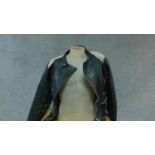 A vintage leather motorcycle jacket. (small size).