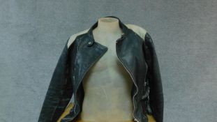 A vintage leather motorcycle jacket. (small size).