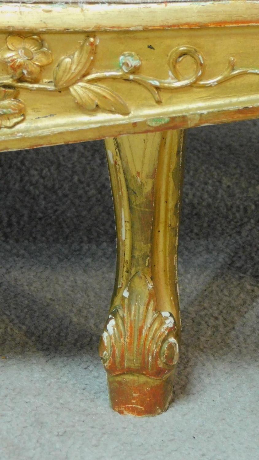 A 19th century rococo style giltwood three seat canape with shell carved cresting back rail and - Image 10 of 10