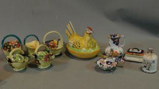 A collection of Art Deco Tuscan Decoro pottery baskets and other ceramic items.