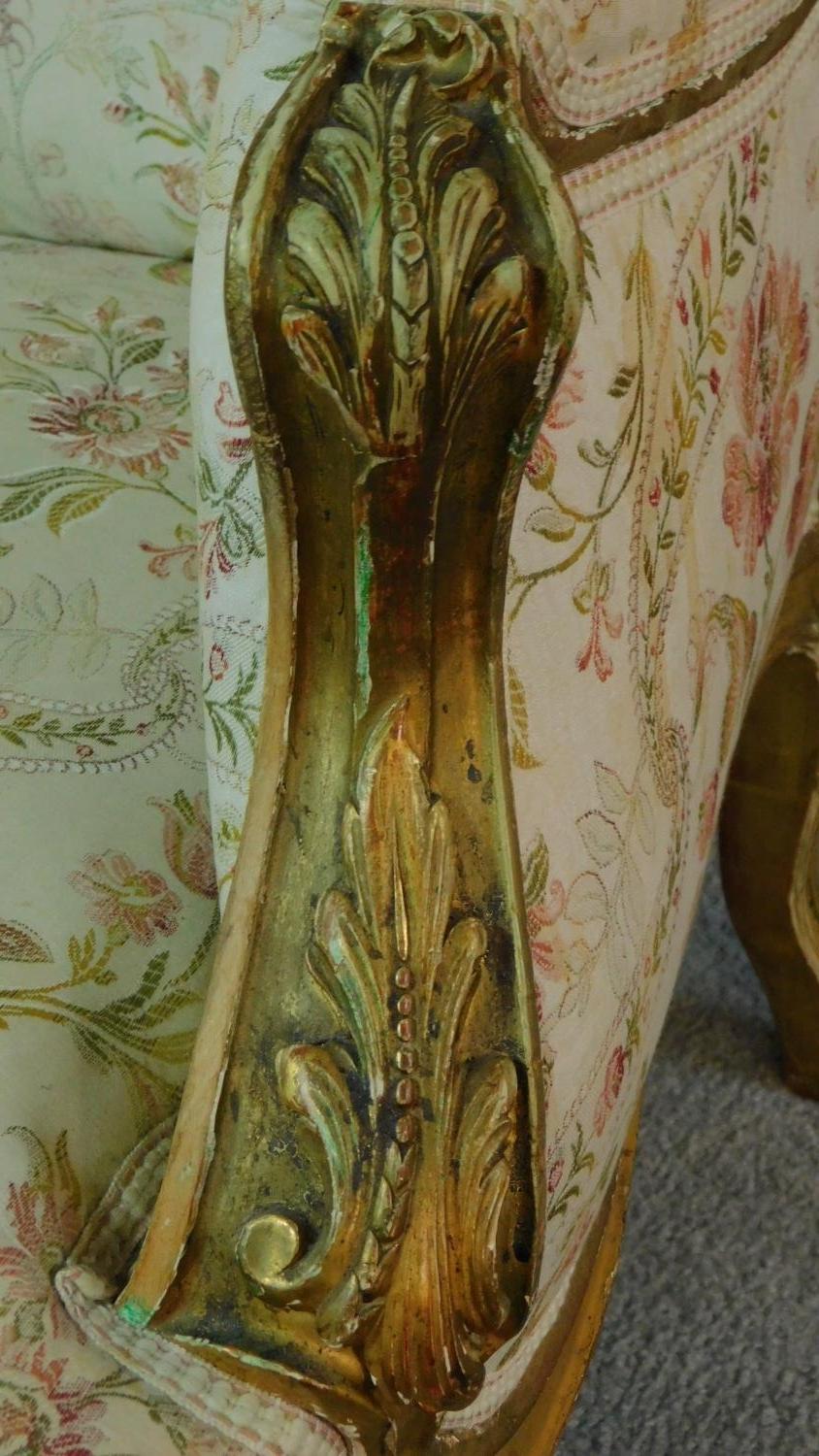 A 19th century rococo style giltwood three seat canape with shell carved cresting back rail and - Image 6 of 10