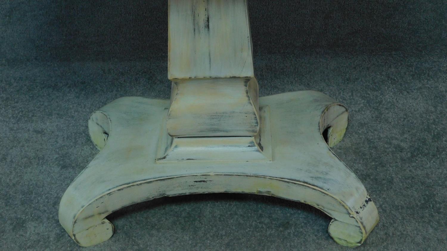 An early 19th century distressed painted table with polished tilt top on platform base. H.72 W.91 - Image 3 of 7