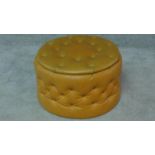 A 1960's vintage padded faux leather upholstered lidded stool. H.31 W.50 D.50cm