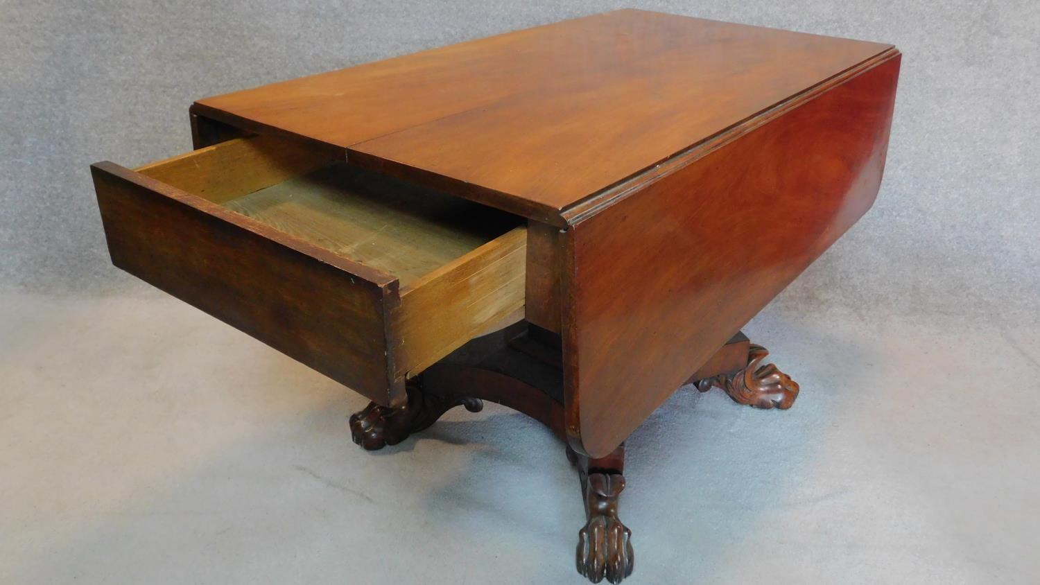 An early 19th century mahogany drop flap dining table fitted end drawer on quadruped platform base - Image 3 of 4