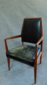 A mid 20th century Danish teak armchair upholstered in leather. H.97cm