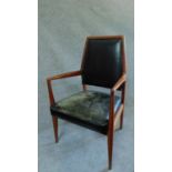 A mid 20th century Danish teak armchair upholstered in leather. H.97cm