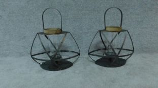 A pair of industrial style metal framed candle lanterns H.48cm W.41cm