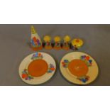 A hand painted porcelain set, Bizarre range by Clarice Cliff, Crocus design. Includes conical