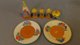 A hand painted porcelain set, Bizarre range by Clarice Cliff, Crocus design. Includes conical