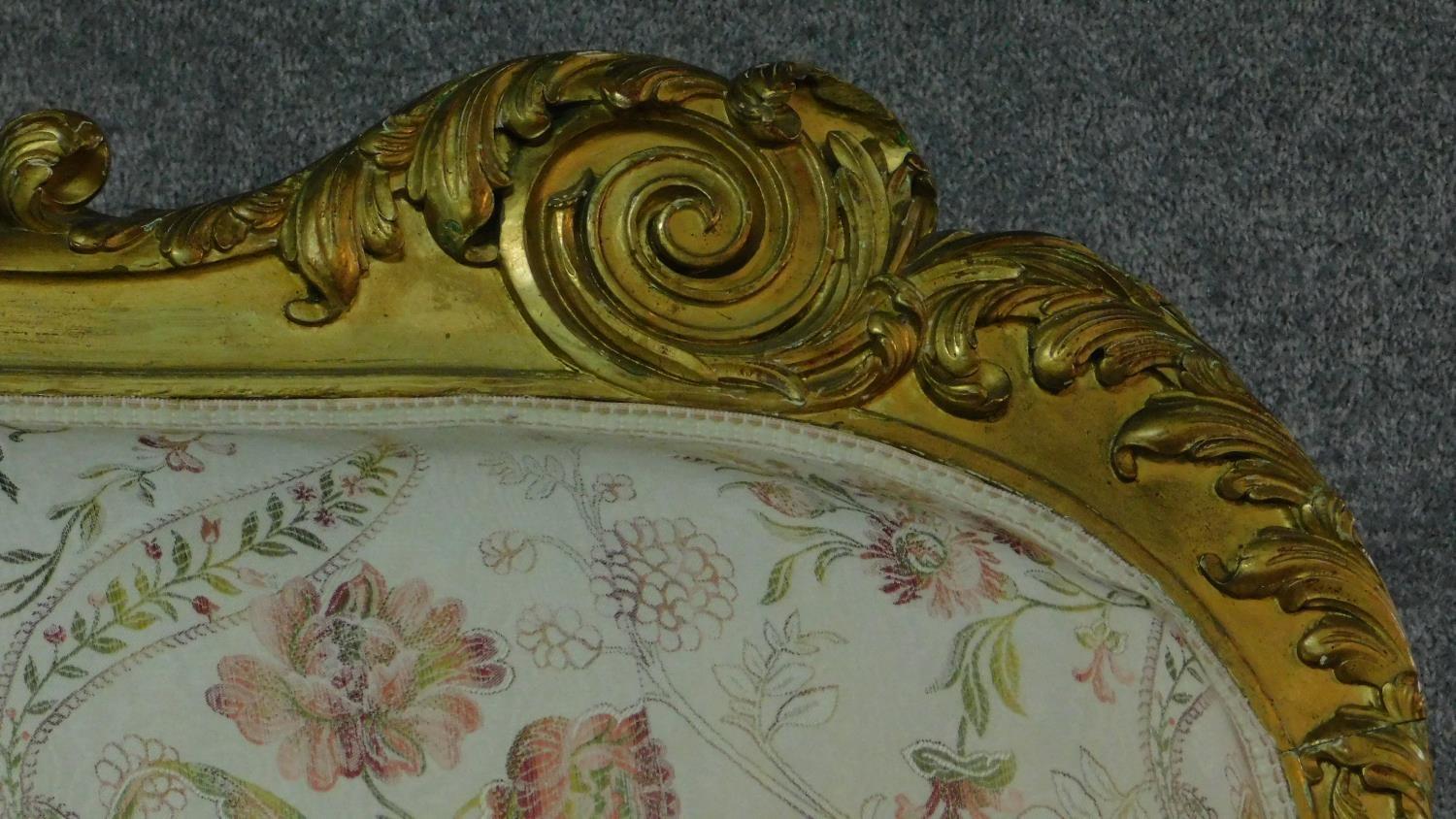 A 19th century rococo style giltwood three seat canape with shell carved cresting back rail and - Image 4 of 10