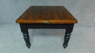 A Victorian country pine draw leaf table on painted base. H.76cm L.190cm W.109cm