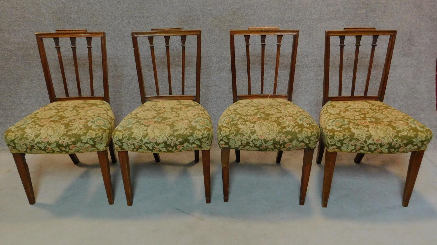 A set of four 19th century Hepplewhite style mahogany dining chairs with stuffover floral