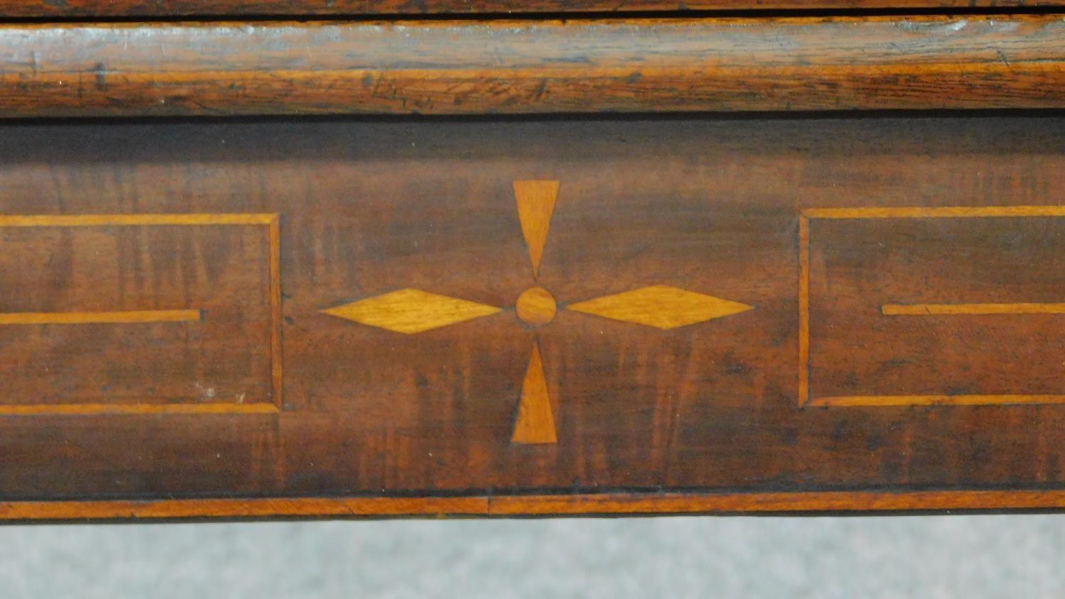 An early 19th century mahogany inlaid flap top tea table on tapering sabre supports. H.72 W.90 D.91 - Image 2 of 6