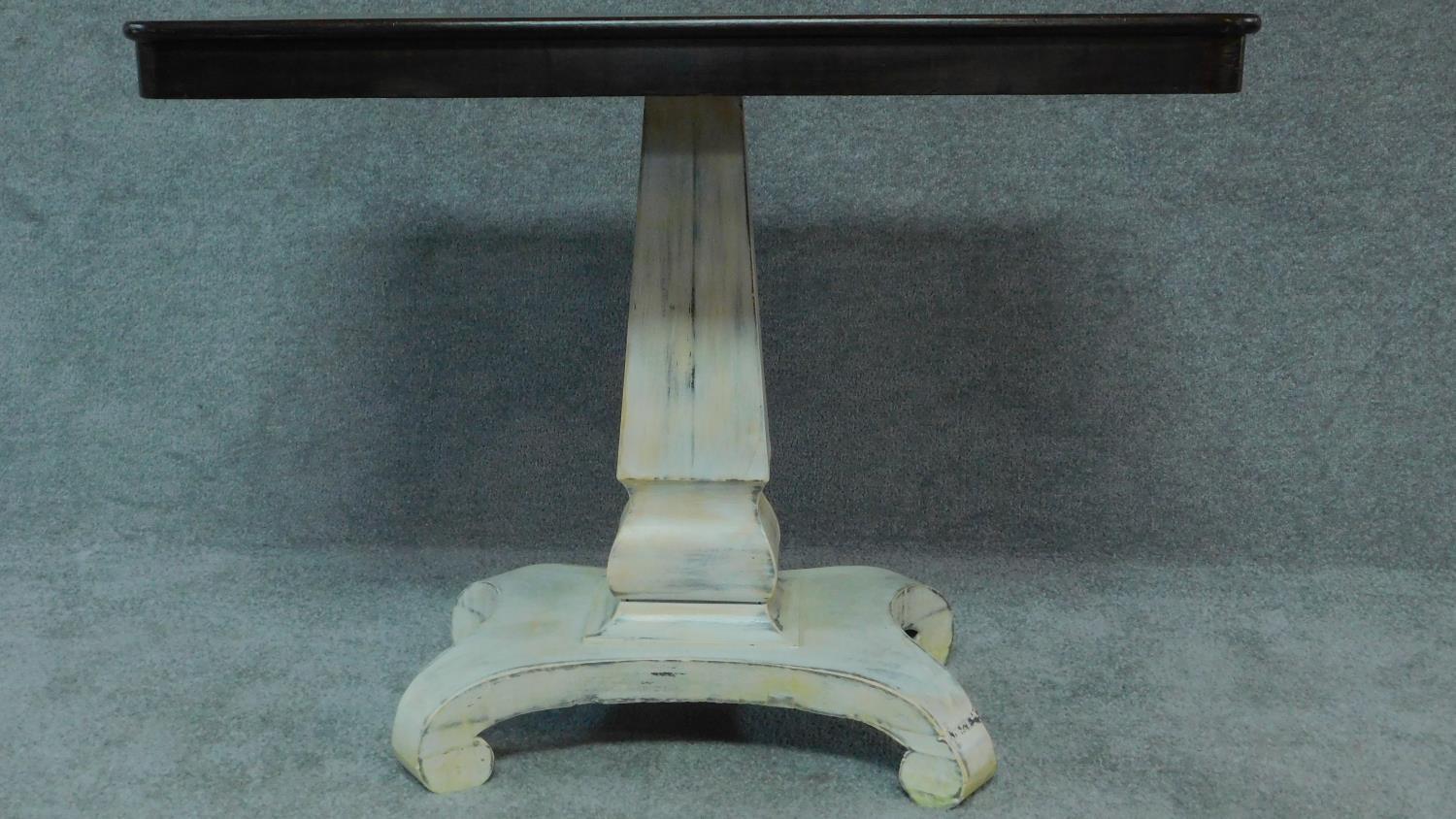 An early 19th century distressed painted table with polished tilt top on platform base. H.72 W.91 - Image 2 of 7
