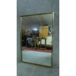 A rectanglar brass framed wall mirror. H.92cm W.61cm