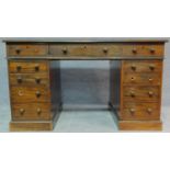 A 19th century mahogany pedestal desk with an arrangement of nine drawers on plinth base. H.77 W.137