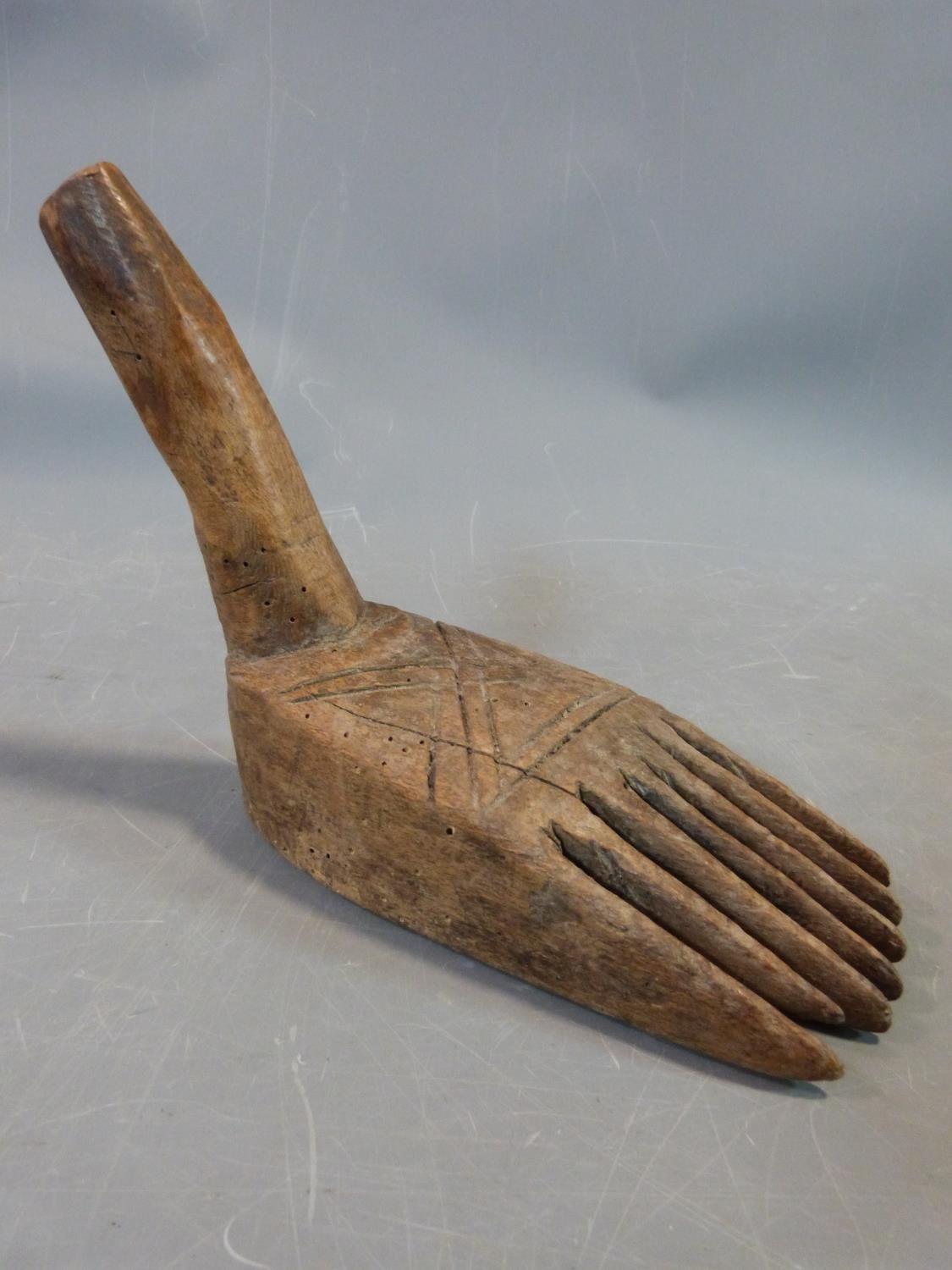 A tribal wooden foot carving and an Indian brass bowl with repousse animal design and a wooden stand - Image 2 of 10