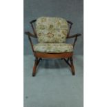 A mid 20th century stained beech Ercol style armchair. H.84cm