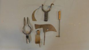 A miscellaneous collection of vintage and antique metal garden tools.