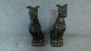 A pair of moulded figures of guard dogs. H.77cm