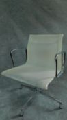 An Eames style white mesh office armchair by Vitra. H.85cm