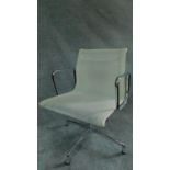 An Eames style white mesh office armchair by Vitra. H.85cm