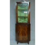 A Georgian style mahogany and satinwood inlaid corner cabinet. H.184 W.67cm