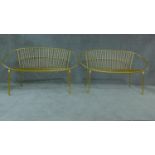 A pair of gilt metal vintage style garden benches. H.81cm W.120cm D.55cm