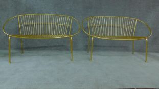 A pair of gilt metal vintage style garden benches. H.81cm W.120cm D.55cm