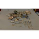 A collection of silver plate including tea pots, bone marrow spoons, sugar tongs, bonbon dish and