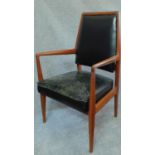 A mid 20th century Danish teak armchair upholstered in leather. H.97cm
