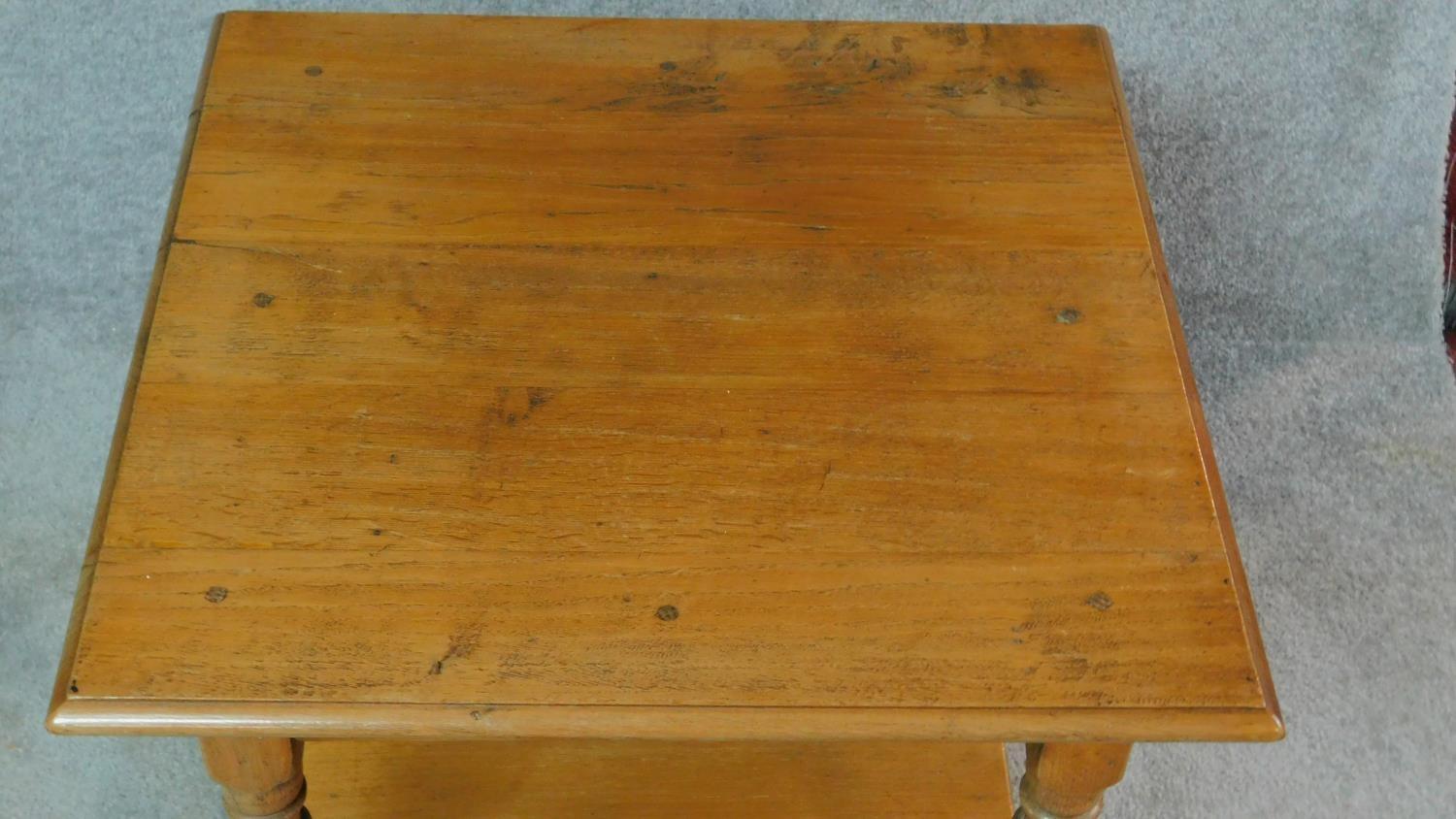 A pair of antique style country oak side tables on turned supports united by undertier. H.50 W.61 - Image 3 of 5