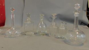 Five Cut Glass decanters and a lidded jar. Fine quality with original stoppers and hand cut
