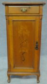 A late Victorian oak and inlaid narrow cabinet fitted frieze drawer on cabriole supports. H.99 W.