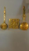 Two 19th century brass lidded strainers and a brass trivet. W.58 (widest)