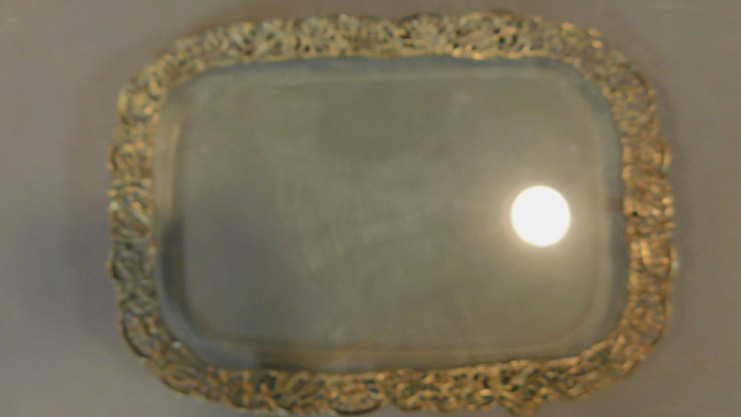 Two silver plated trays, one with glass base and pierced floral and bird design. W.65cm L.41cm - Image 2 of 3