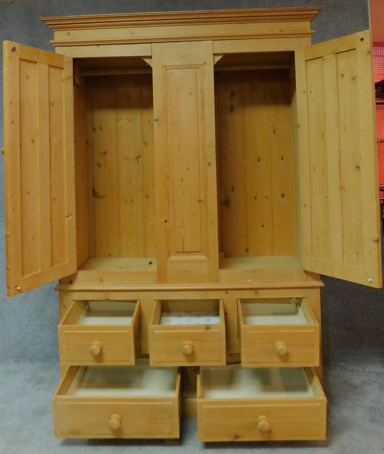 A pine Victorian style wardrobe with hanging section above an arrangement of drawers. H.198 W.140 - Image 2 of 5