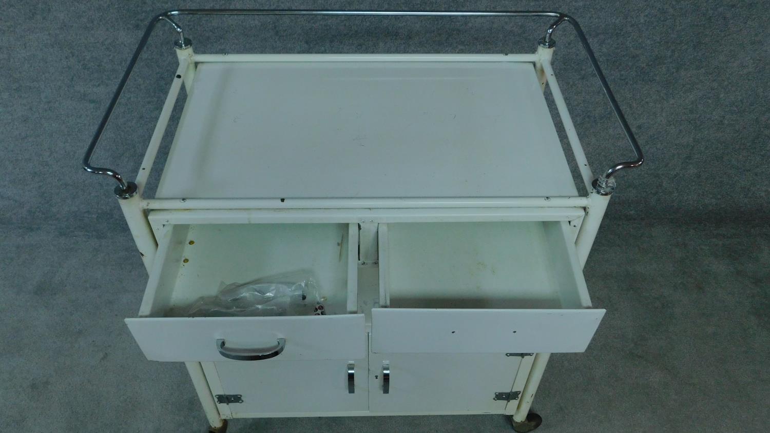 A white painted and metal medical cabinet/trolley with drawers and cupboards on casters. H.90 W.86 - Image 4 of 6