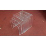 A nest of three graduating clear perspex tables. H.40 W.40 D.33cm (largest)