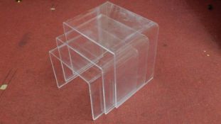 A nest of three graduating clear perspex tables. H.40 W.40 D.33cm (largest)