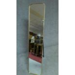 A full height gilt metal cheval mirror of narrow proportions on easel stand. H.151