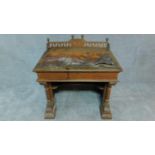 An unusual Victorian oak and mahogany Gothic style pedestal desk. H.74 W.93 D.68cm