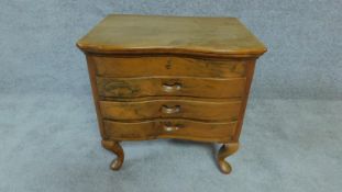 A small Eastern teak sewing chest with hinged lift up lid. H. 49cm W. 49cm D. 37cm