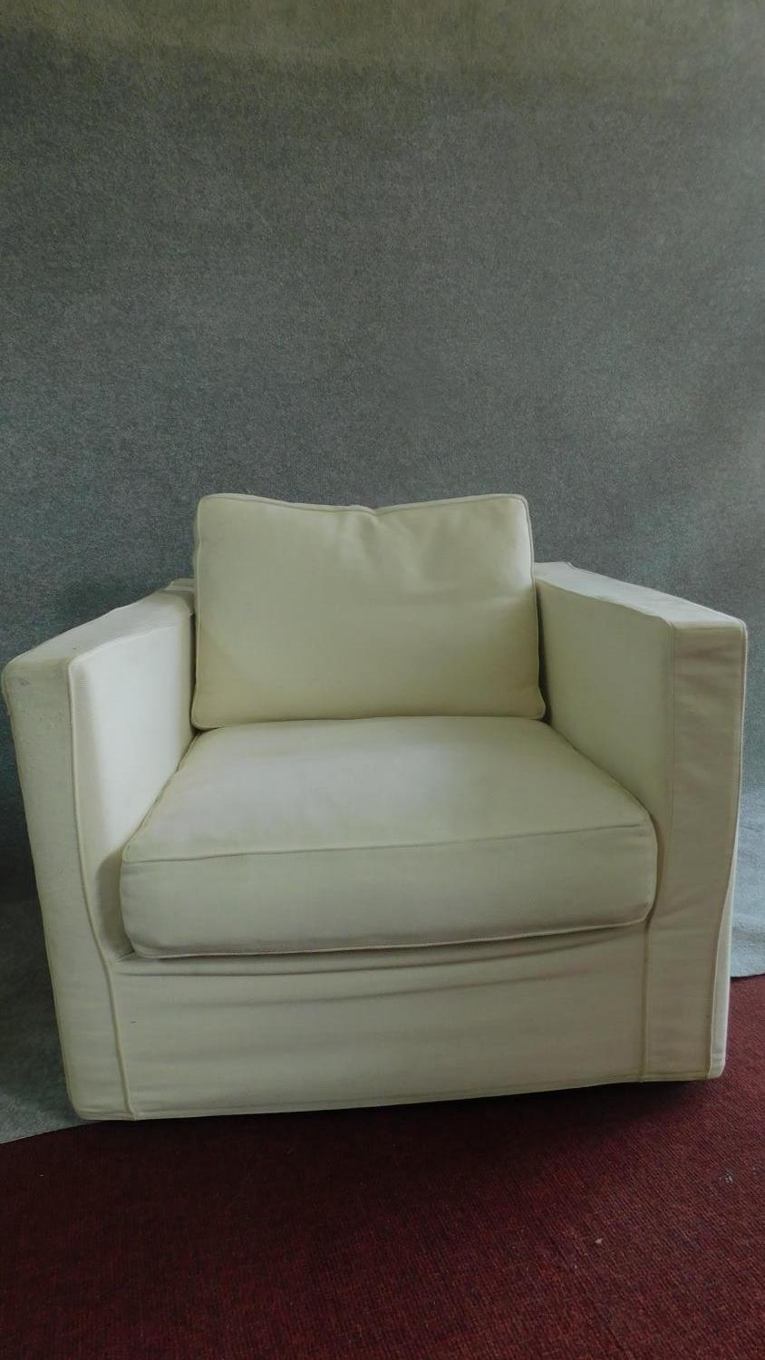 A pair of armchairs upholstered in cream, makers label to base. H.79cm - Image 2 of 4