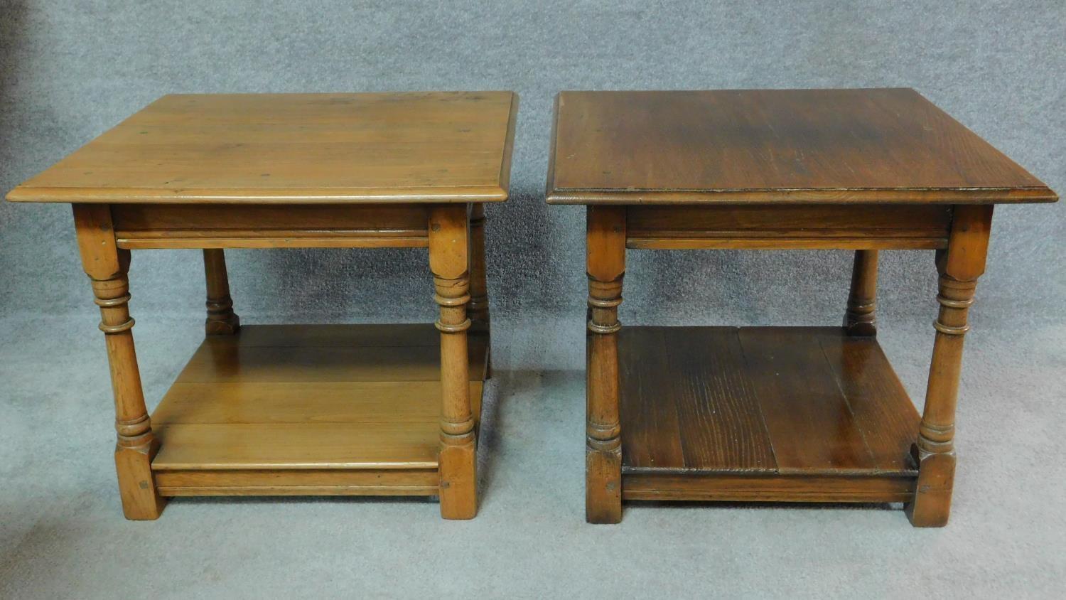 A pair of antique style country oak side tables on turned supports united by undertier. H.50 W.61