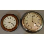 Two Victorian style wall clocks, one with wooden surround and one with antique metal finish. Both