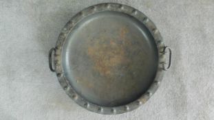 An antique studded two handled brass bowl. W.49cm
