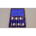 Six silver coffee spoons in case, with embossed and twisted handles, fully hallmarked: Birmingham,