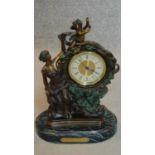 An ornate French style mantel clock on marble base. H.35cm