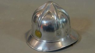 A vintage Eastern European fireman's helmet 18.5x18.5 (head size)